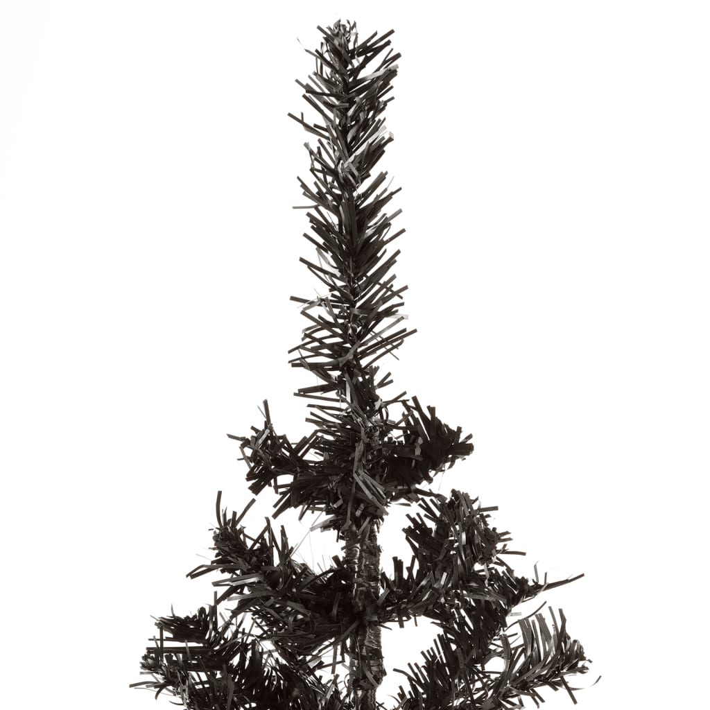 Slim 4 ft black artificial Christmas tree with PVC branches on a stand.