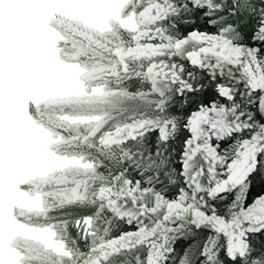 A 7.5ft flocked snow green artificial Christmas tree with PVC and PE branches.