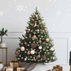 A decorated Christmas tree with rose gold balls, LED lights, and a tree topper.