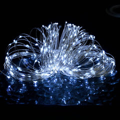 A 49.2ft string of 150 cold white LEDs on copper wire, glowing against a dark background.