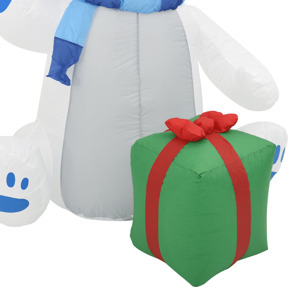 6ft inflatable polar bear wearing a hat and scarf, illuminated by energy-saving LED lights.