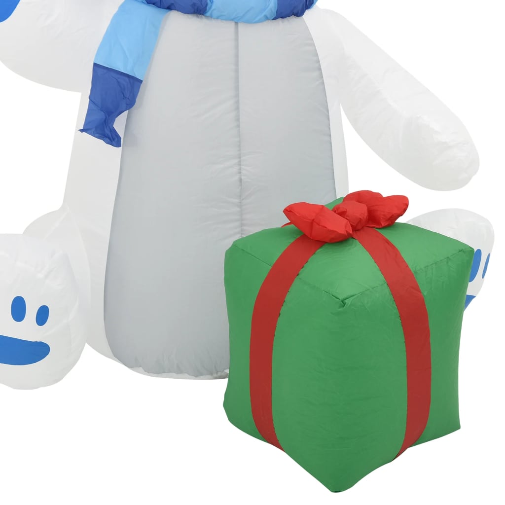 8ft inflatable polar bear wearing a hat and scarf, illuminated by energy-saving LED lights.