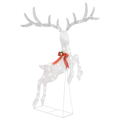 A white, illuminated flying reindeer Christmas decoration with a red bow and green bells.
