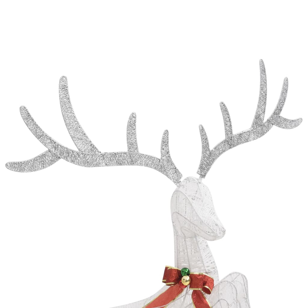 A white wireframe reindeer decoration with large antlers and a red bow.