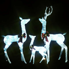 White silver LED-lit reindeer family Christmas decoration with red bows.