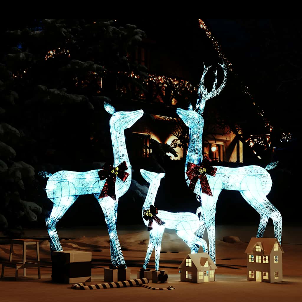 White LED-lit reindeer family Christmas decoration with silver accents and red bows.