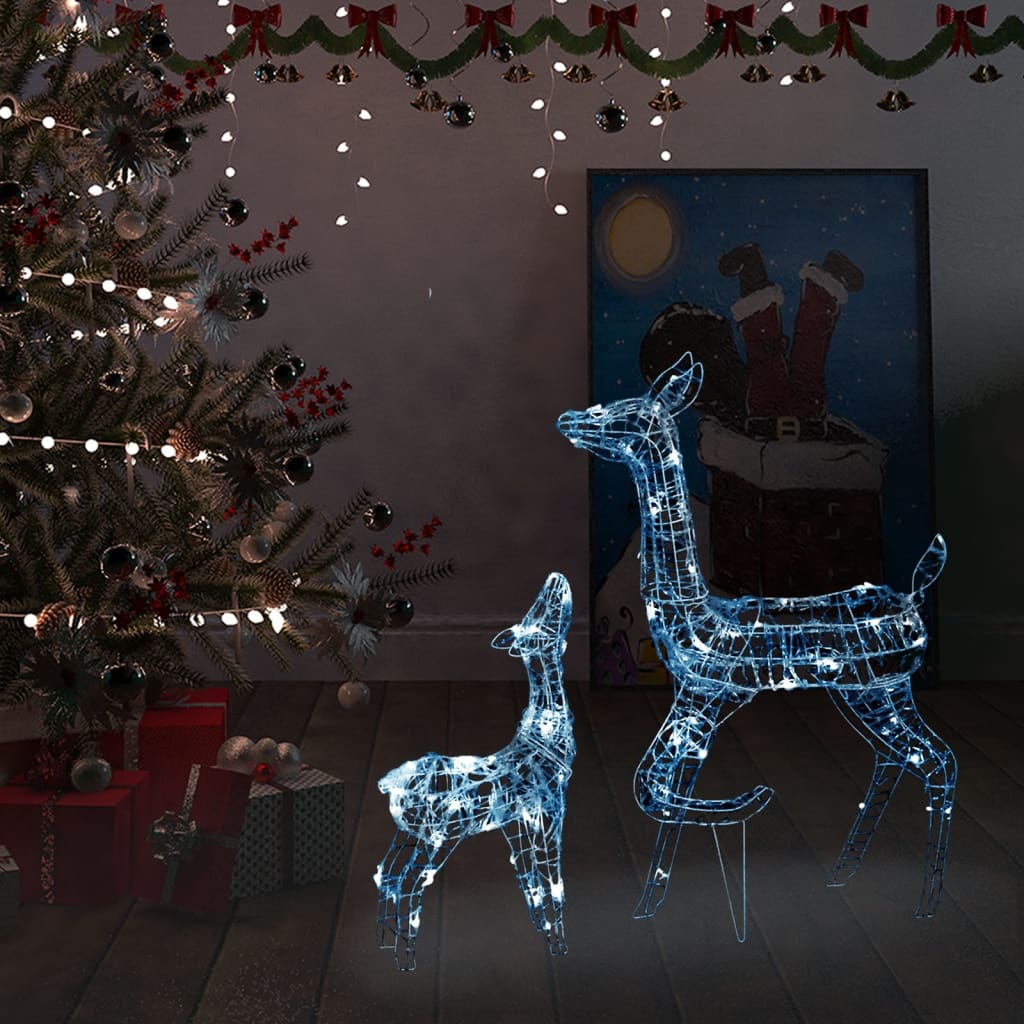 Acrylic reindeer family decoration with 160 cold white LEDs, featuring adult and fawn on a lit Christmas tree background.