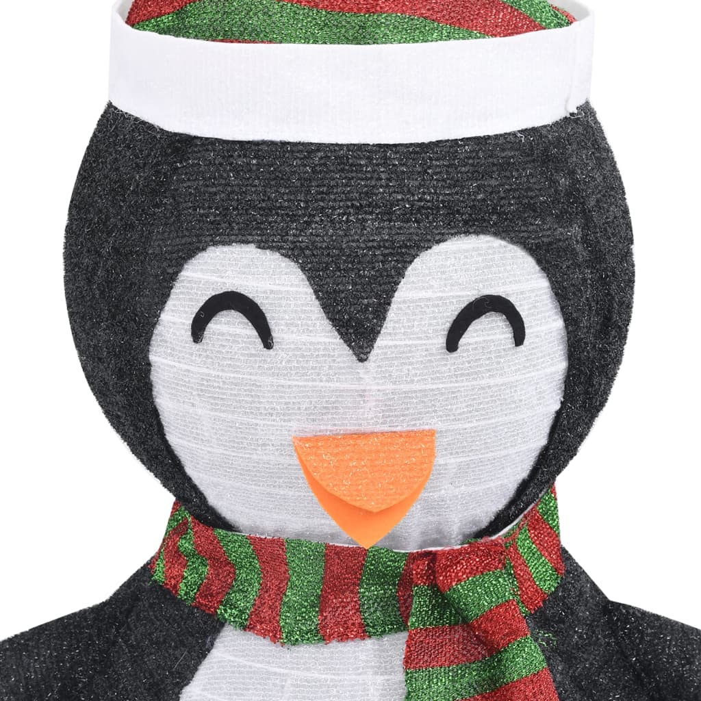 4ft black and white LED snow penguin figure with green striped hat and scarf for Christmas decor.