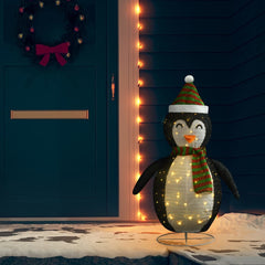 4ft LED snow penguin figure in black and white fabric with green scarf and hat, standing on snowy porch.