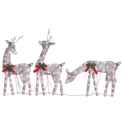 Three lighted reindeer decorations with red bows and green accents.