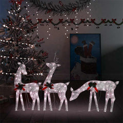 Lighted gold reindeer family decor with warm white LEDs and red bows.