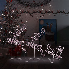 Acrylic flying reindeer and sleigh with warm white LED lights on stands.