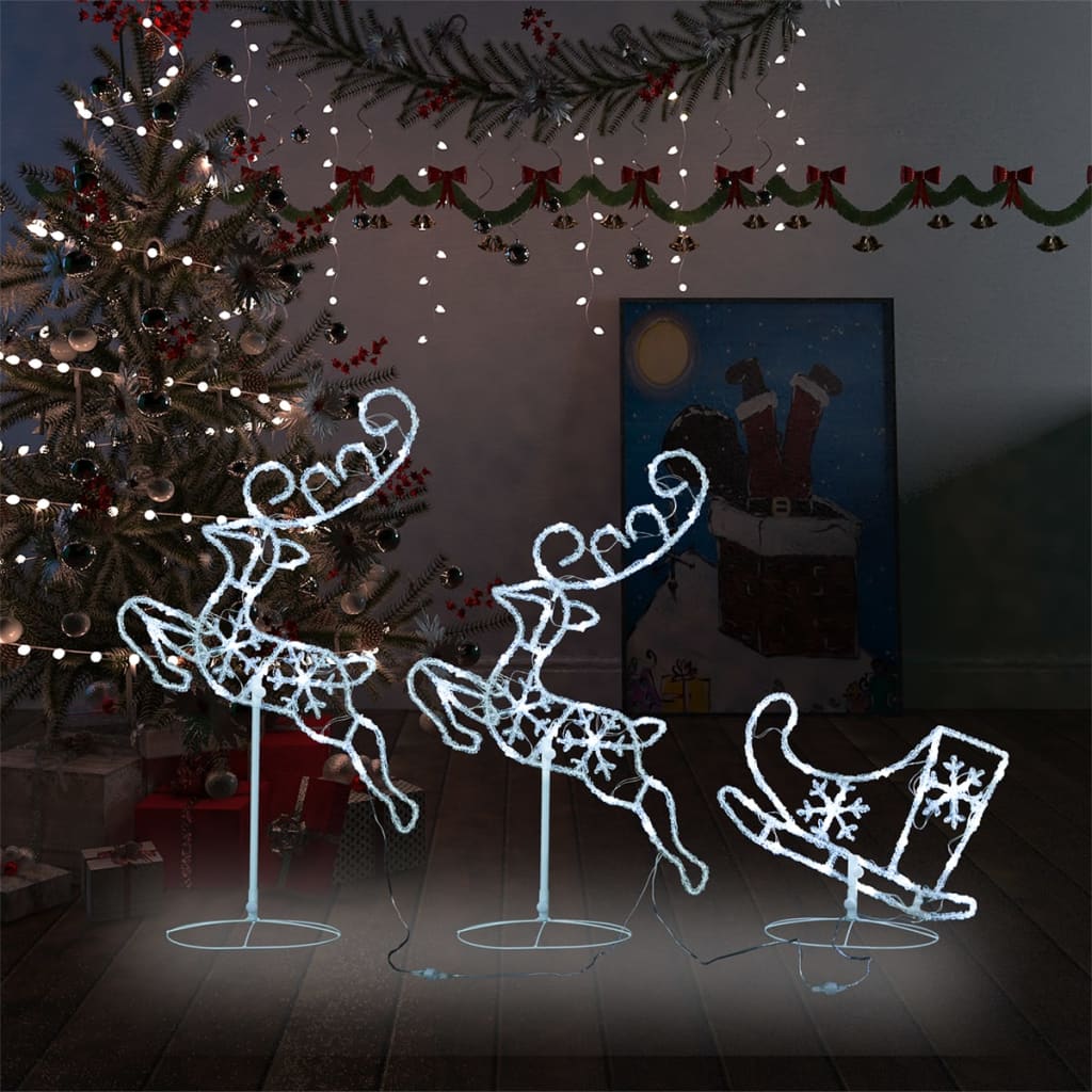Acrylic flying reindeer and sleigh Christmas decoration with cold white LEDs on stands.