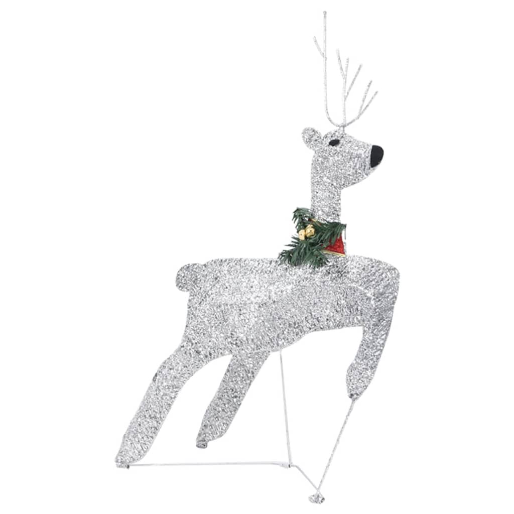 A silver glitter reindeer decoration with a red and green collar stands on a white background.