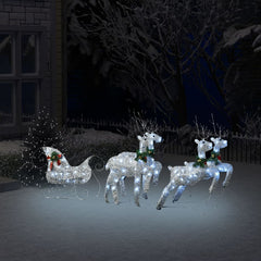 A silver reindeer and sleigh Christmas decoration with 100 LEDs is displayed outdoors in the snow.