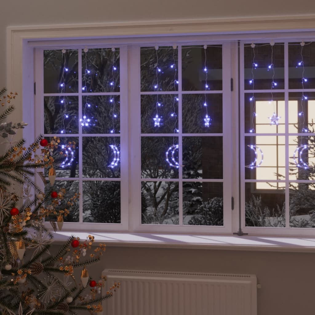 Blue star and moon fairy lights with 138 LEDs on a curtain, illuminating a window.