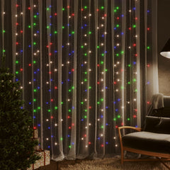 LED curtain fairy lights with 300 colorful LEDs in 8 modes, hung in a cozy room with Christmas tree.