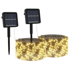 Two solar-powered fairy light strings with 200 warm white LEDs each, featuring black stakes and solar panels.