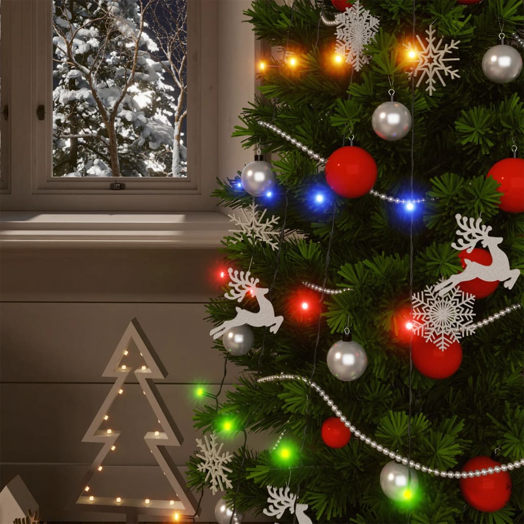 A 5-pack of colorful 200-LED solar fairy lights strung on a decorated Christmas tree with snowy window view.