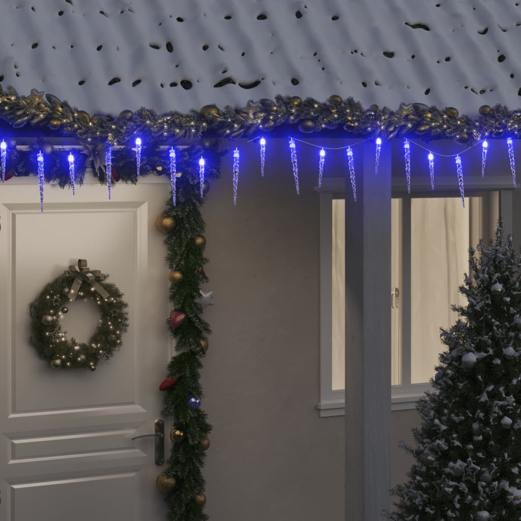 Bostome Blue Acrylic Christmas Icicle Lights illuminate a snowy house exterior.