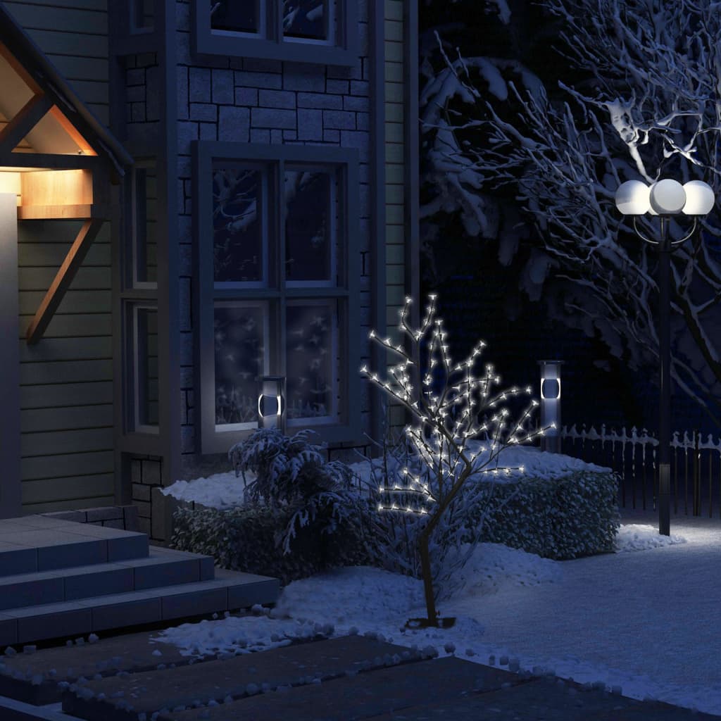 A 4ft cherry blossom Christmas tree with 128 cold white LEDs, shown lit in a snowy nighttime scene.