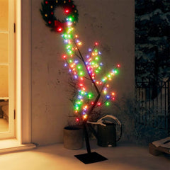 A 4ft cherry blossom Christmas tree with colorful LED lights on a black metal base, placed outdoors near a door with a wreath.