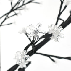 6 ft cherry blossom Christmas tree with 200 warm white LEDs on black branches.