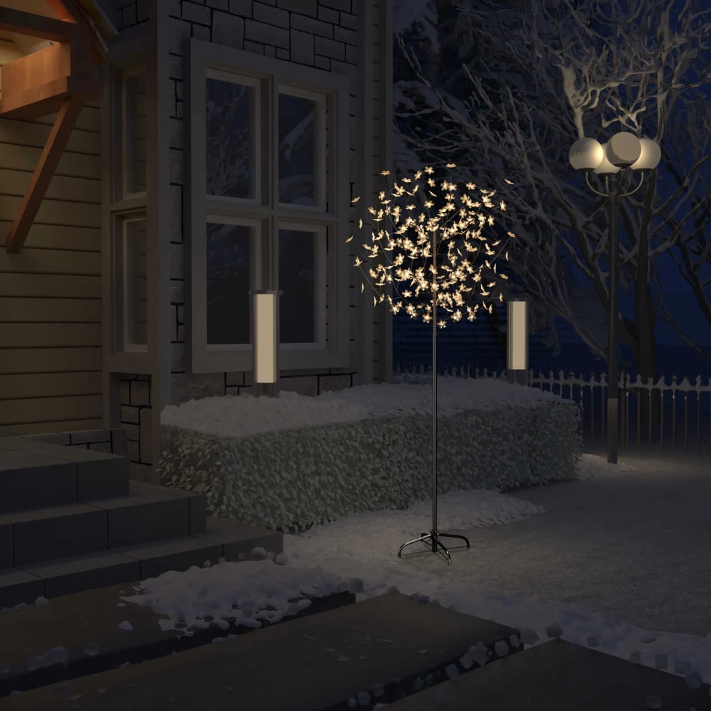 6 ft cherry blossom Christmas tree with 200 warm white LEDs in snowy outdoor setting.