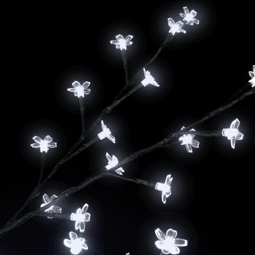 A 6 ft cherry blossom Christmas tree with 200 cold white LEDs illuminating the branches.