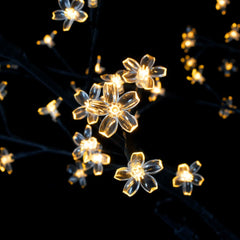 A 7ft cherry blossom Christmas tree with 220 warm white LED lights and a sturdy metal base.