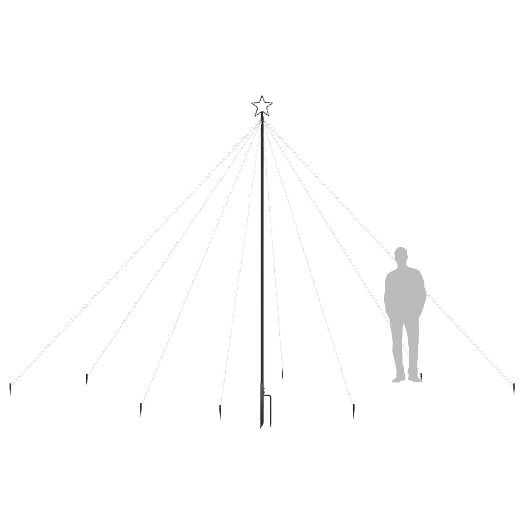 Silhouette of a 12ft LED Christmas tree with star topper and stakes, next to a person.