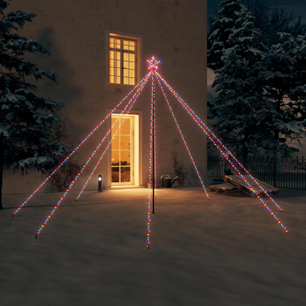 A 12-foot LED Christmas tree with 576 colorful lights illuminating an outdoor snowy scene at night.