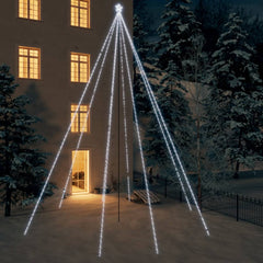 26ft LED Christmas tree with 1300 cold white LEDs in a waterfall design against a building at night.