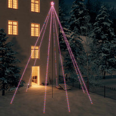 A 26ft LED Christmas tree with 1300 colorful lights illuminating a snowy yard at night.