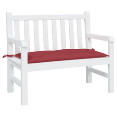 White garden bench with a wine red Oxford fabric cushion tied on top.