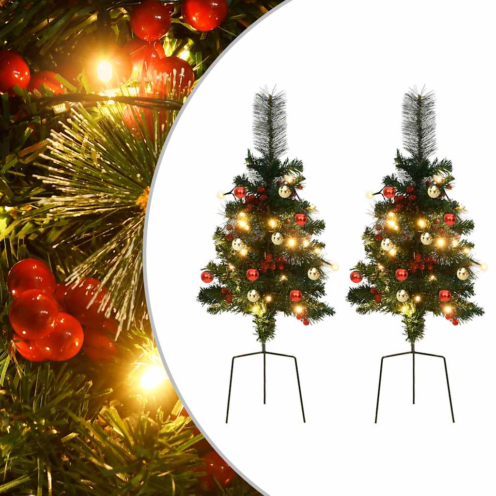 Two 29.9-inch pre-lit green artificial PVC Christmas trees with red berries, ornaments, and LED lights on stands.
