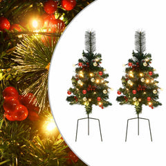 Two 29.9-inch pre-lit green artificial PVC Christmas trees with red berries, ornaments, and LED lights on stands.