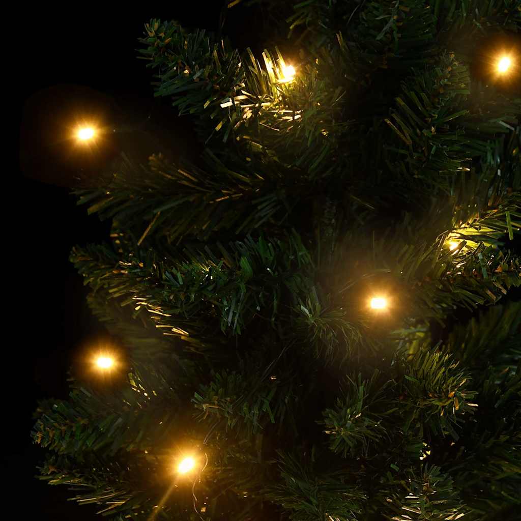 A 3 ft pre-lit artificial Christmas tree with green PVC branches and warm LED lights.