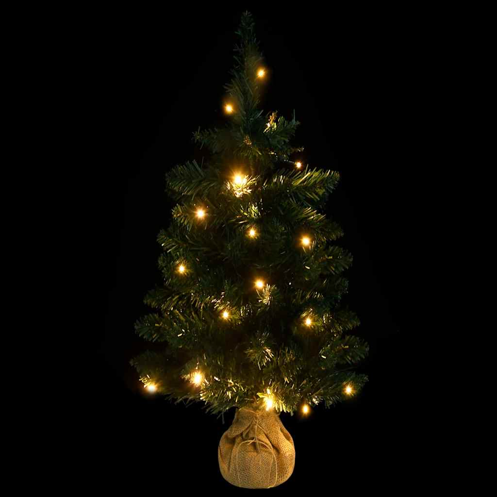 A 3 ft green PVC artificial Christmas tree with pre-lit warm LED lights and burlap-wrapped base.
