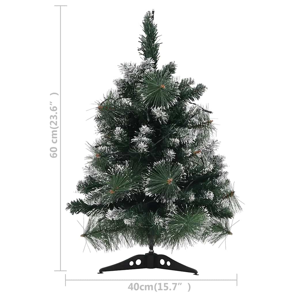 2 ft pre-lit artificial Christmas tree with green PVC branches, snow flocking, and LED lights on a stand.