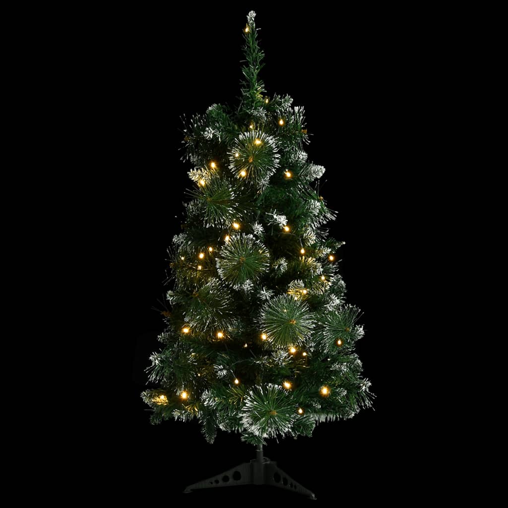 A 3 ft pre-lit artificial Christmas tree with green PVC branches, flocked snow, and warm LED lights on a black background.