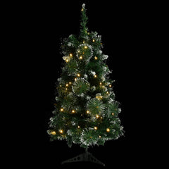 A 3 ft pre-lit artificial Christmas tree with green PVC branches, flocked snow, and warm LED lights on a black background.