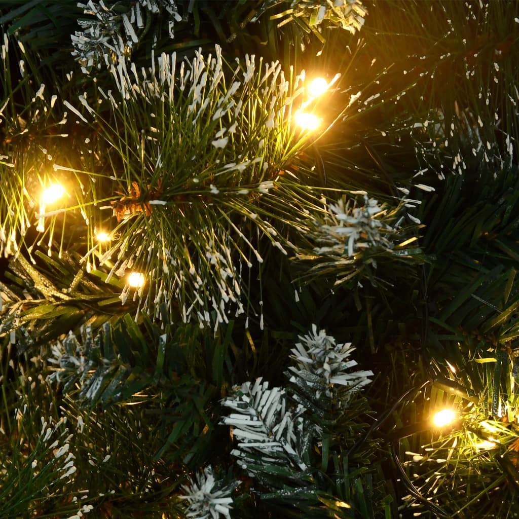 A 3 ft pre-lit artificial Christmas tree with green PVC branches, flocked snow, and warm LED lights.