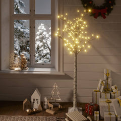 A 5ft willow Christmas tree with 156 warm white LEDs stands in a festive room.