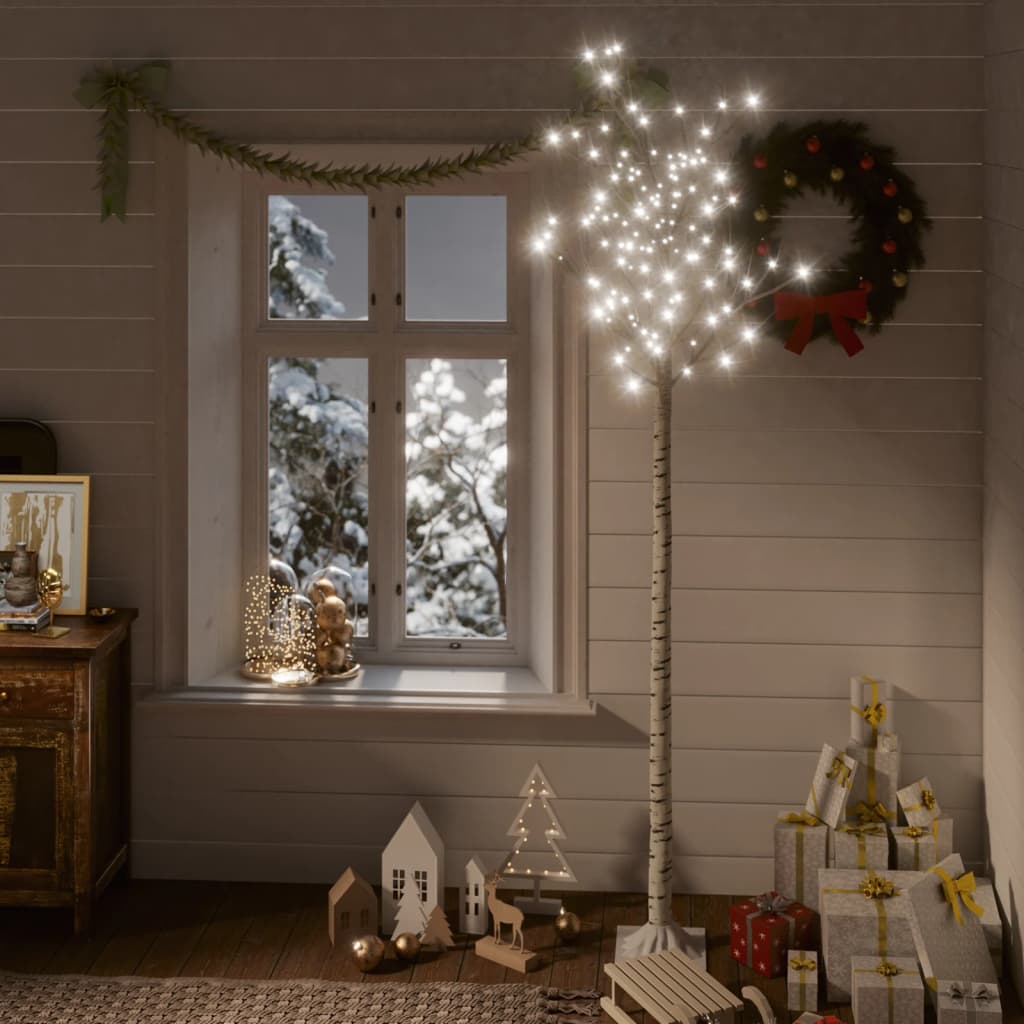 A 7ft LED willow Christmas tree with 220 cold white lights in a cozy holiday room.