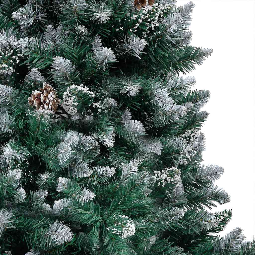 Artificial Christmas tree with snow tips, warm LED lights, pine cones, and gold balls.