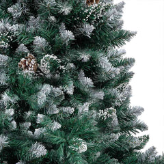 Artificial Christmas tree with snow tips, warm LED lights, pine cones, and gold balls.