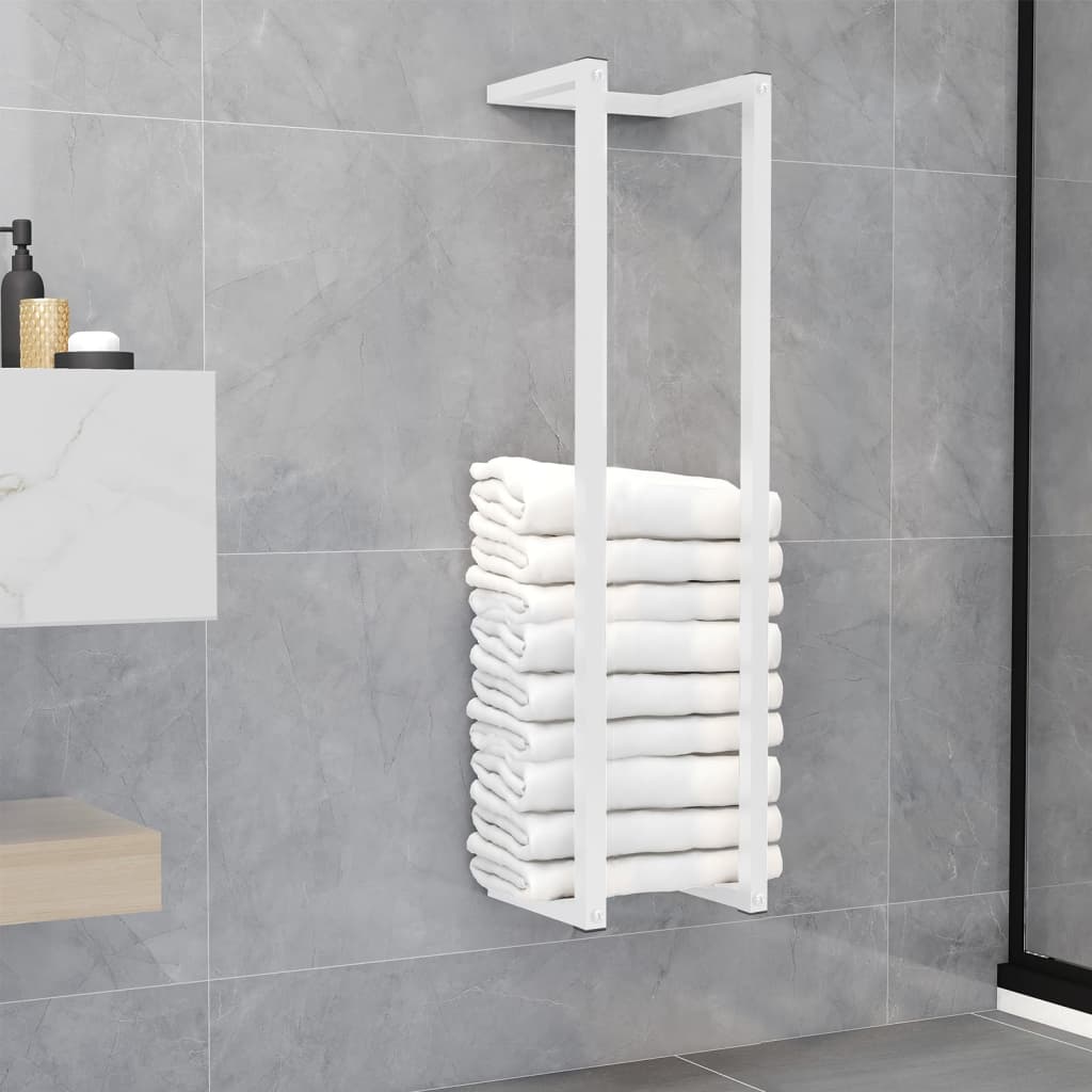 White steel towel rack mounted on bathroom wall, holding stacked white towels.