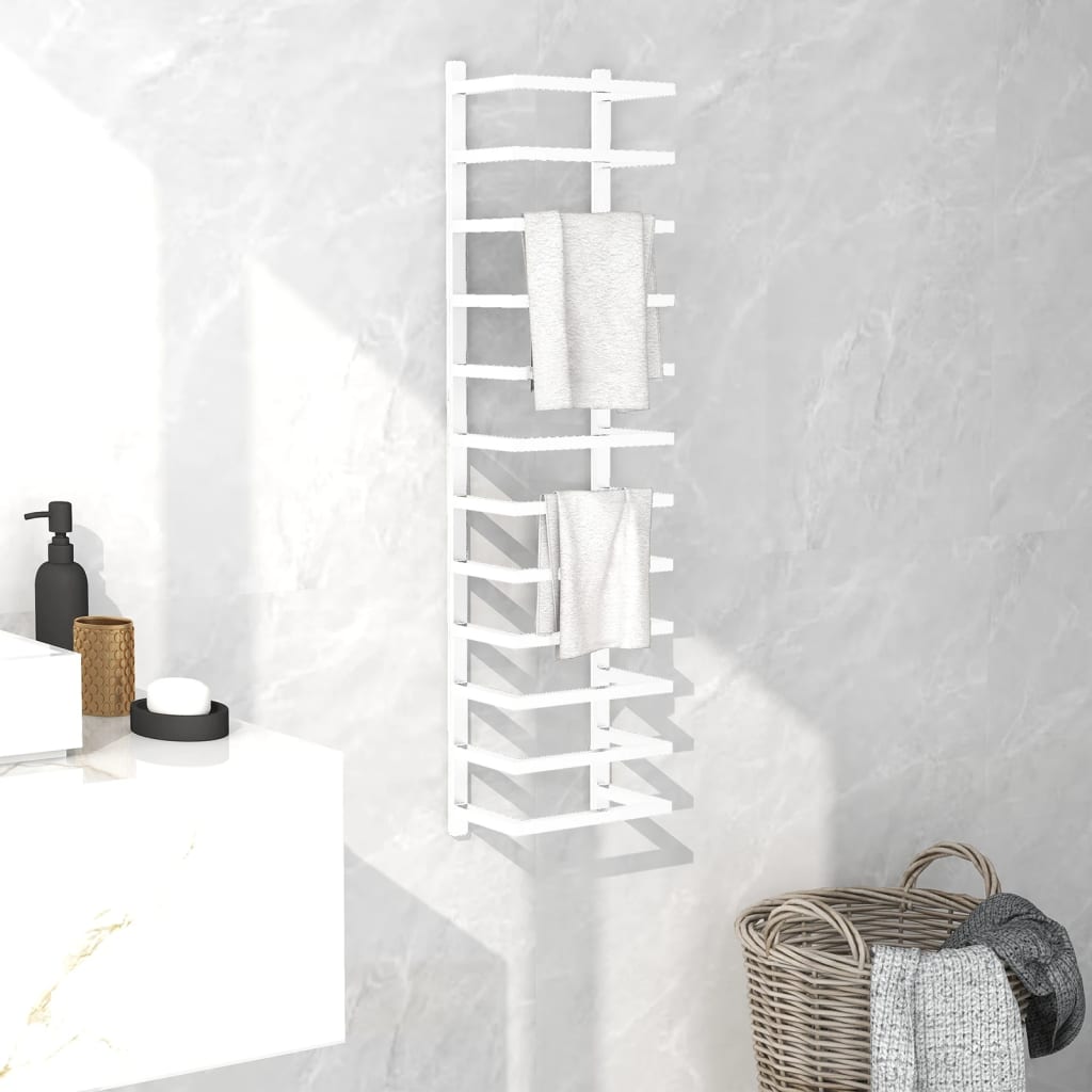 White steel towel rack mounted on a bathroom wall, holding folded white towels.