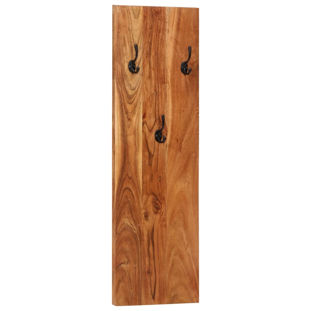 A wooden wall-mounted coat rack with three black hooks on a vertical acacia board.